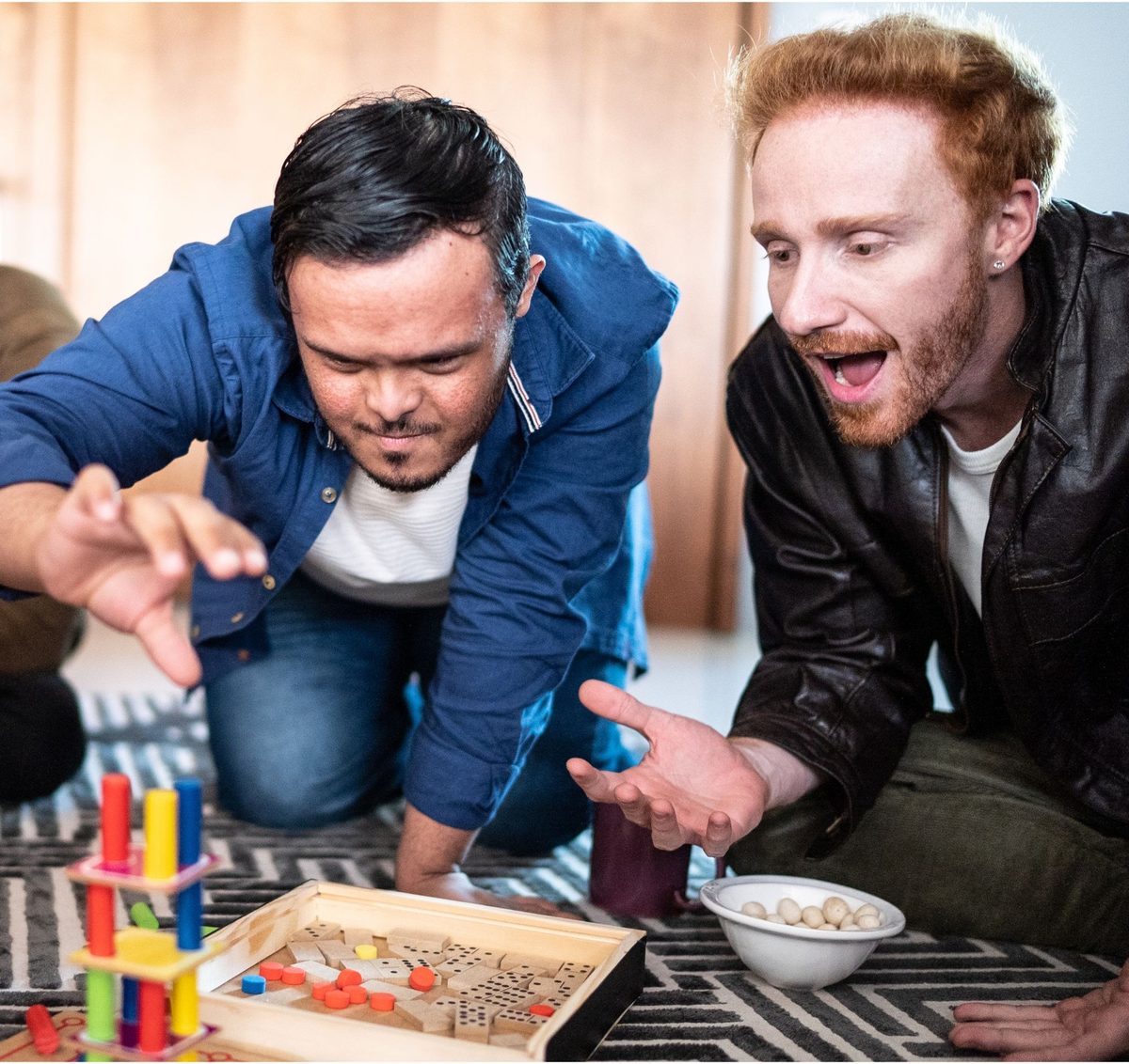 Two friends playing a board game together