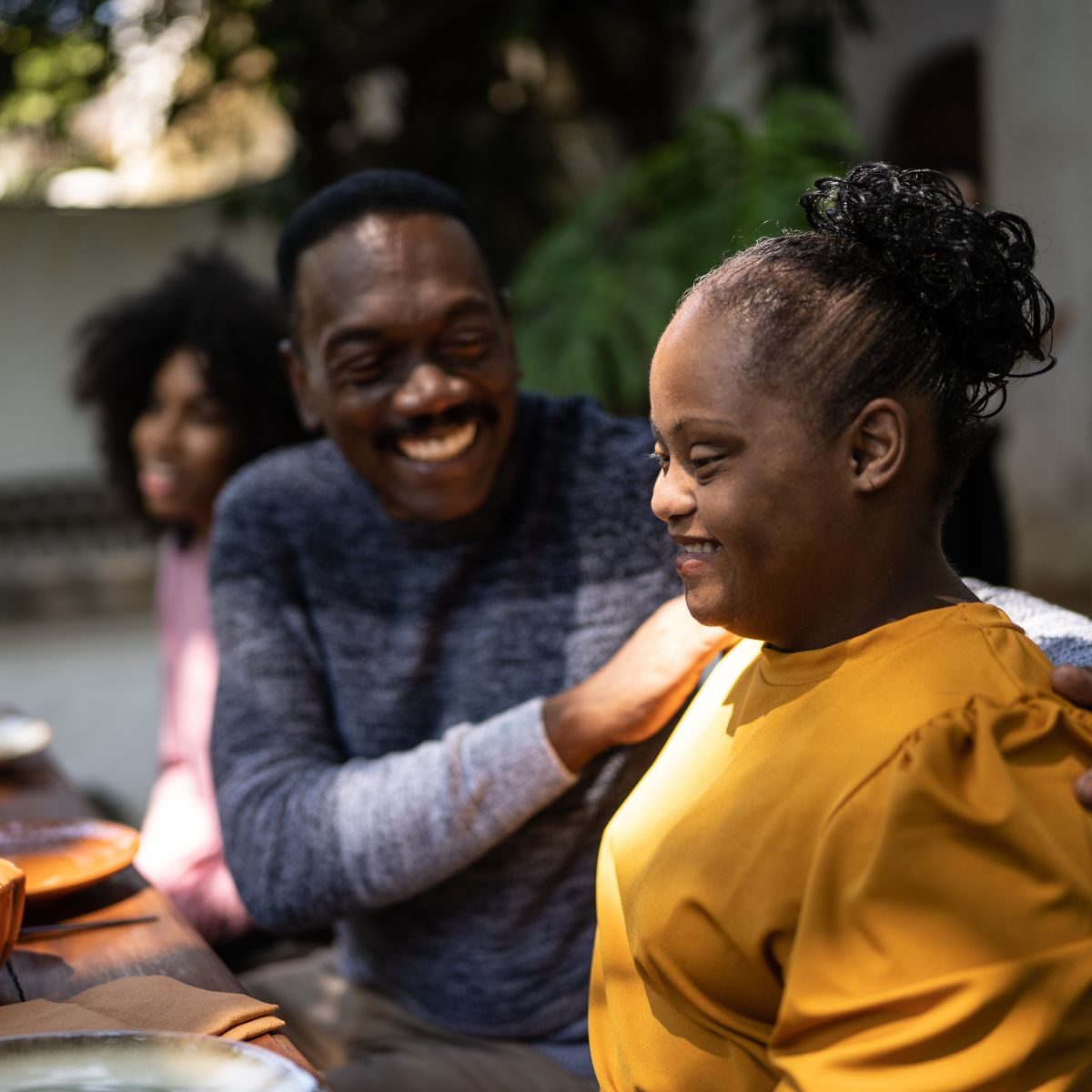 Friends laughing together outdoors